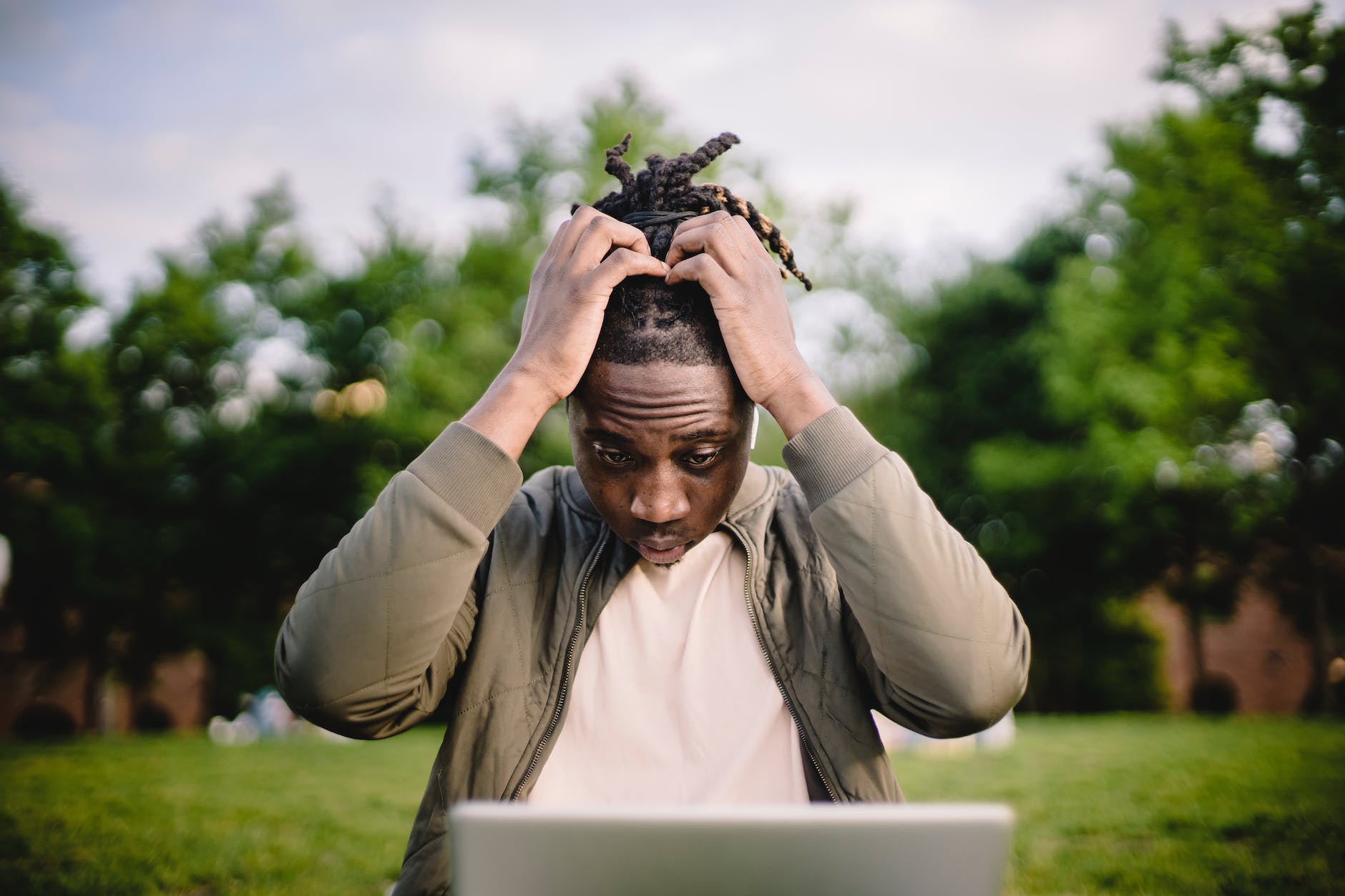 Man looking at computer in confused way